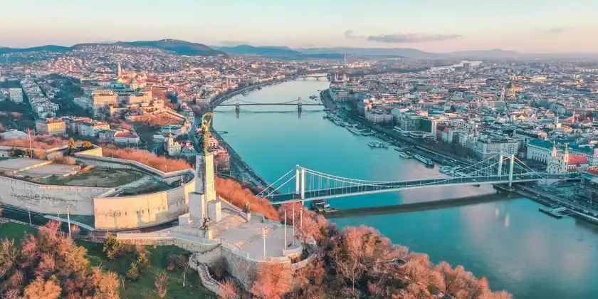Budapest Chain Bridge illuminated at night over the Danube river — iconic Danube river cruise highlight